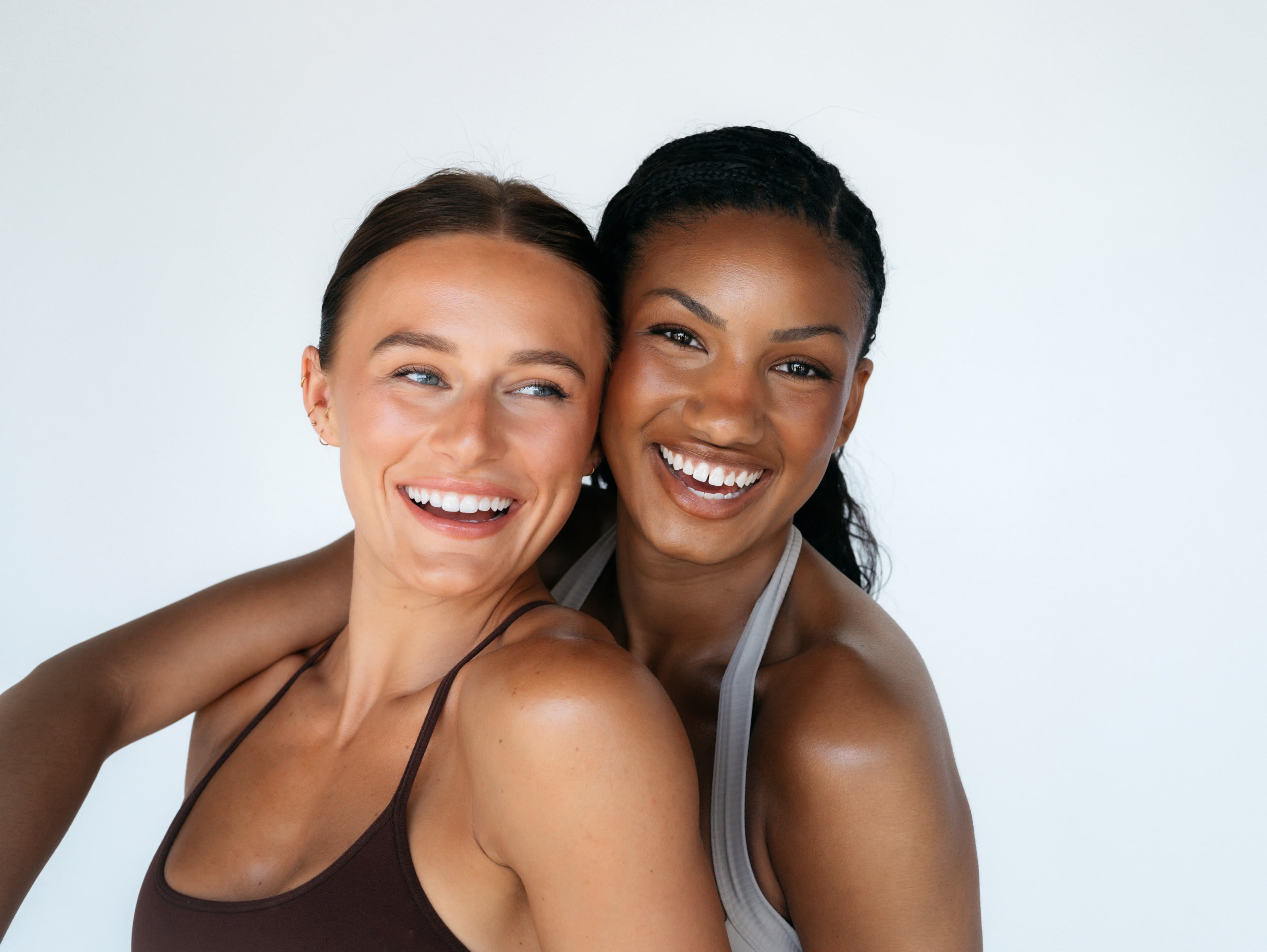 Two friends smiling together